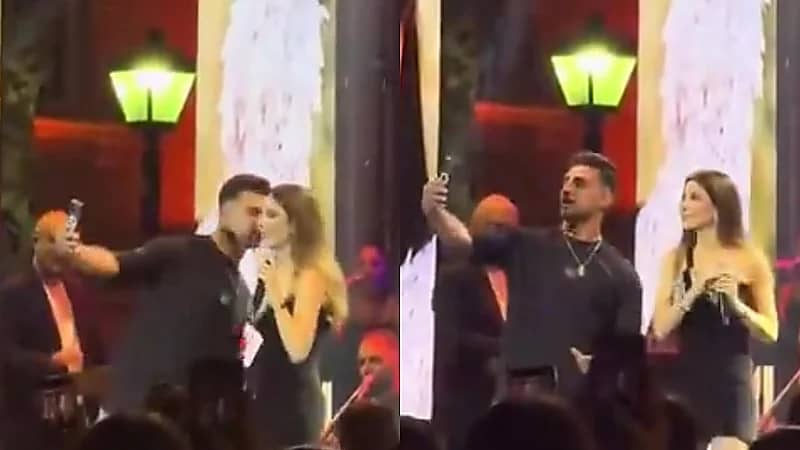 معجب يضع نانسي عجرم في موقف محرج ويفاجئها بقبلة على المسرح.. فيديو