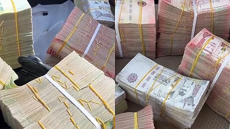 بالفيديو.. قائد مركبة يستعرض بحملة لمبالغ نقدية كبيرة